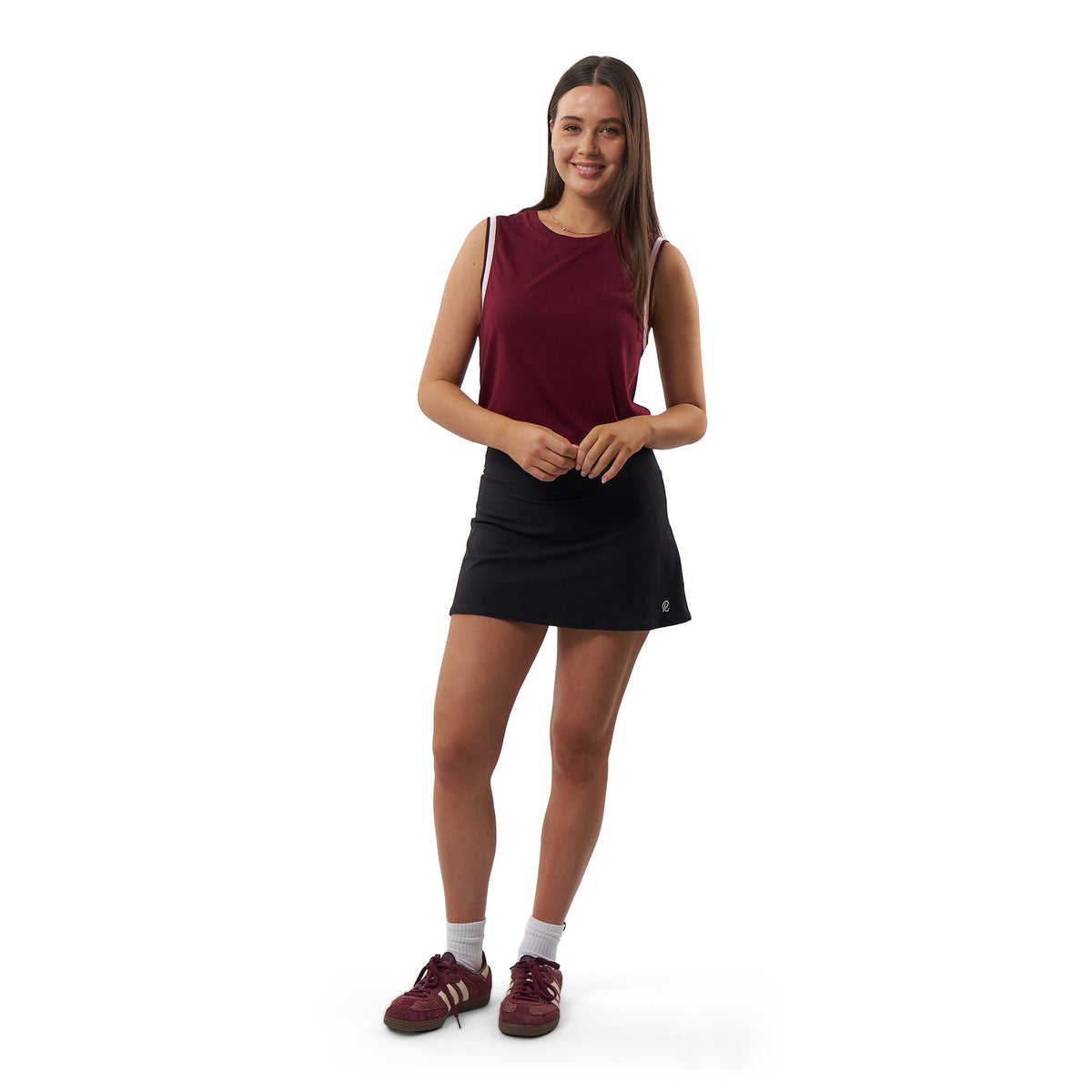 Tennis model wearing burgundy athletic tank top