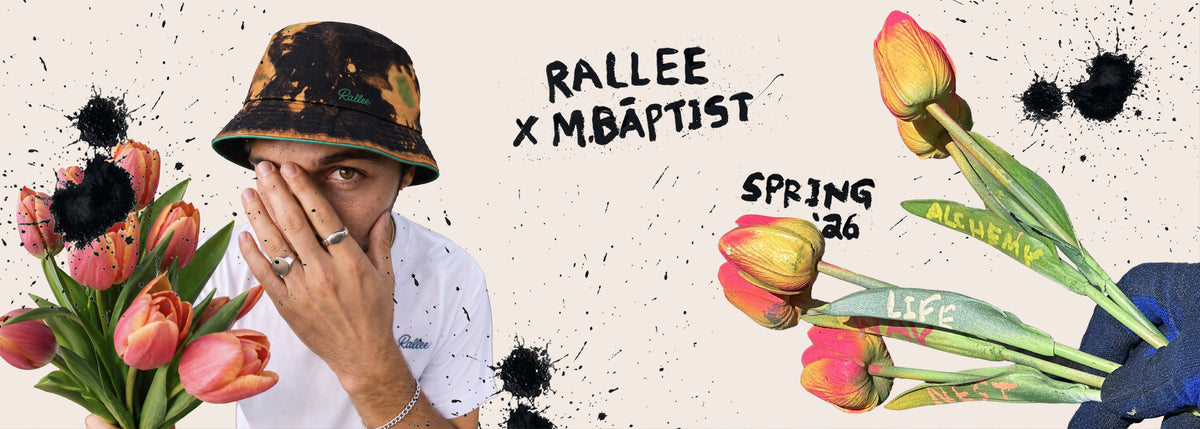 A stylized promotional graphic featuring a person wearing a black bucket hat with yellow and orange floral print, a white shirt, and multiple tulip bouquets on a beige background with black paint splatters. Handwritten text reads 'RALLEE x M.BAPTIST', 'SPRING 26', and 'LIFE'.