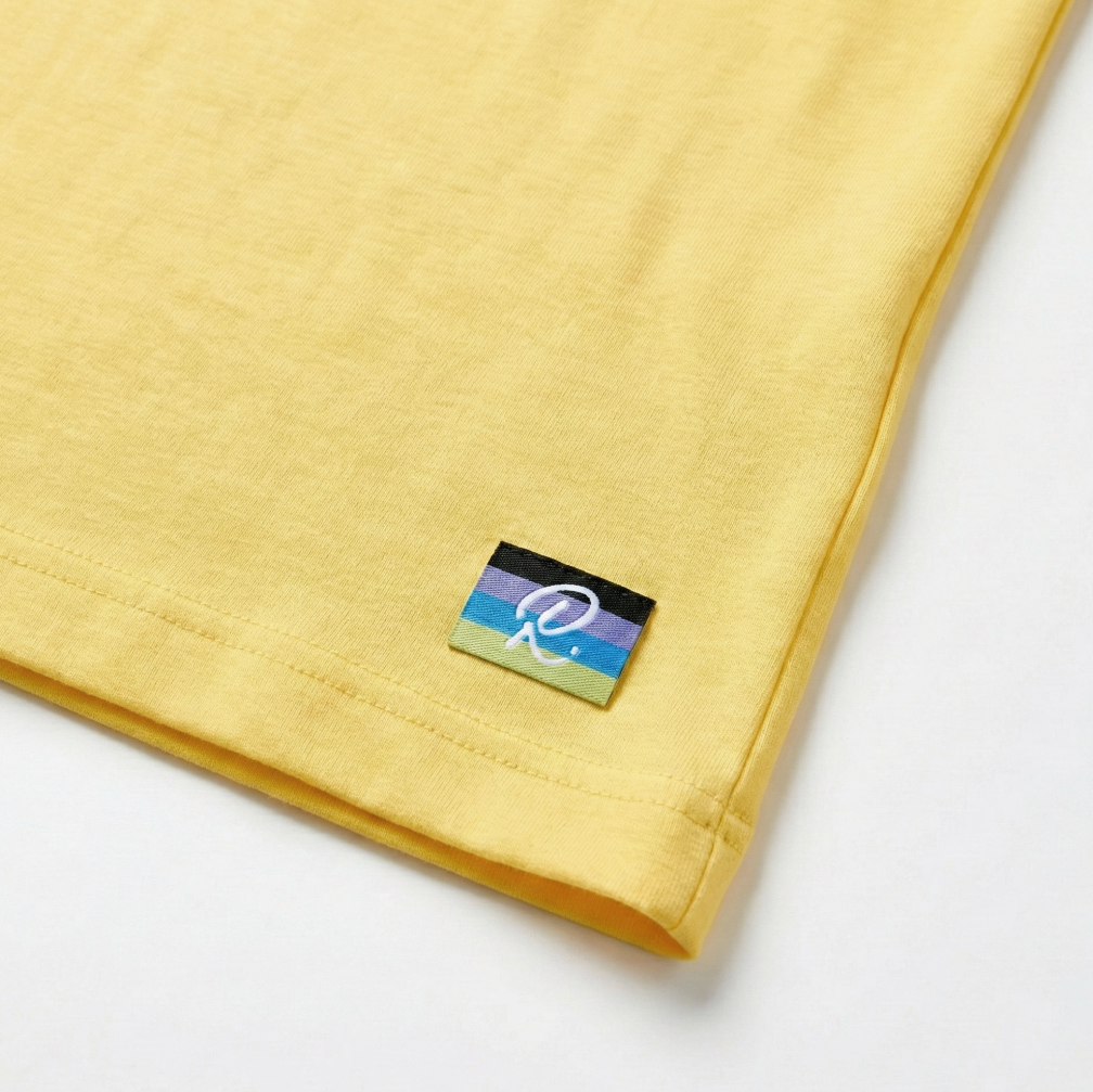 Yellow fabric with a logo tag on a white background