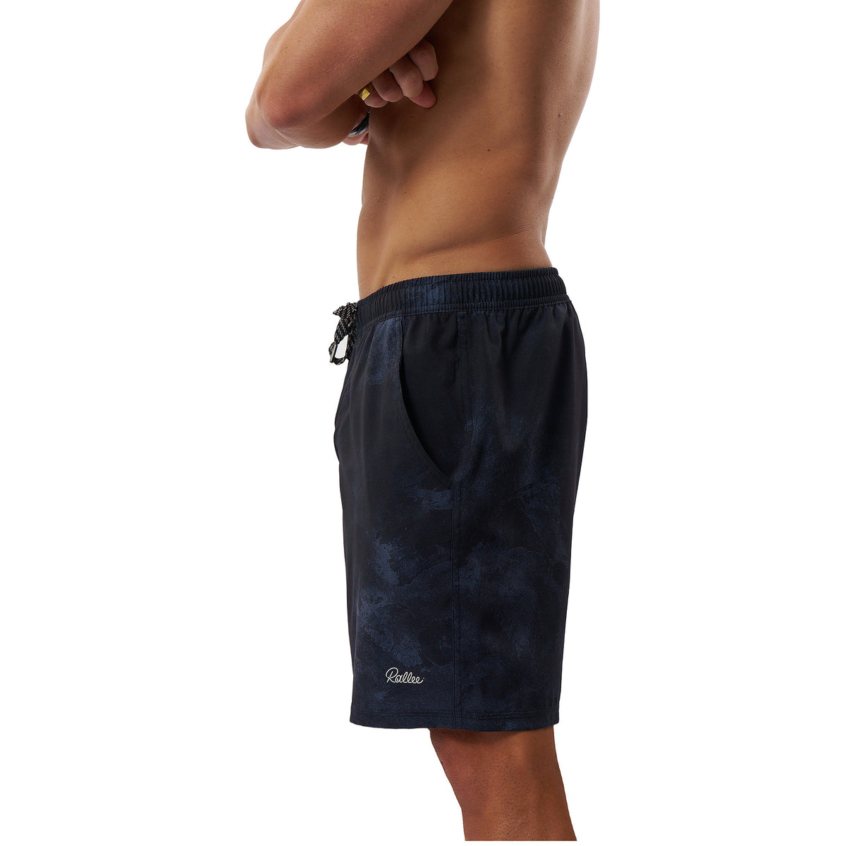 A side profile view of a man wearing dark navy blue swim trunks with a subtle tonal pattern and a small white 'Galileo' logo near the hem, set against a plain white background.