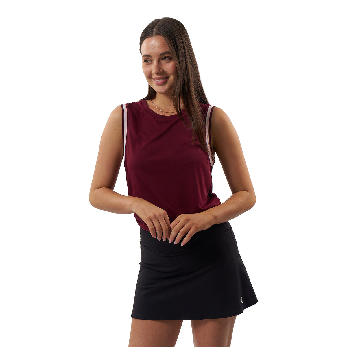 A woman modeling a sleeveless athletic top in deep burgundy with thin white shoulder stripes and a black tennis skirt, set against a plain white background.