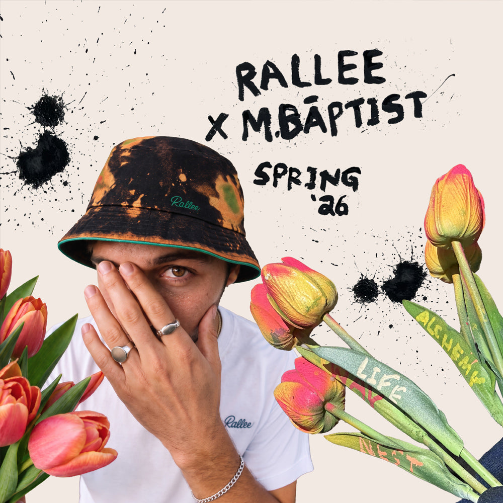 A promotional graphic for 'Rallee x M.Baptist Spring '26' featuring a man wearing a black and orange tie-dye bucket hat with green, red, and yellow stripes on the brim, a white t-shirt with a small blue 'Rallee' logo, and silver rings.